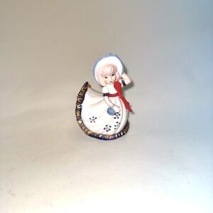 Vintage and Charming Porcelain Figurine with Red and Blue Accents